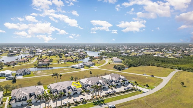 bird's eye view featuring a residential view and a water view