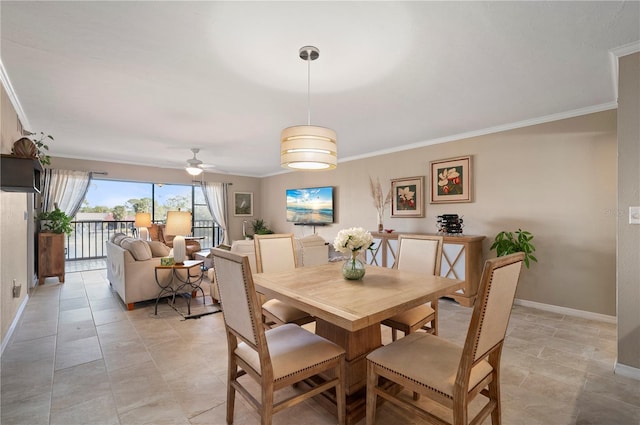 dining area featuring baseboards, a ceiling fan, and ornamental molding