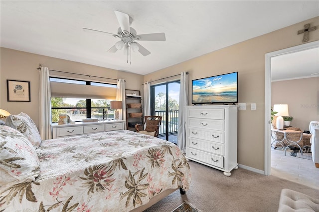 bedroom featuring baseboards, carpet floors, access to exterior, and a ceiling fan