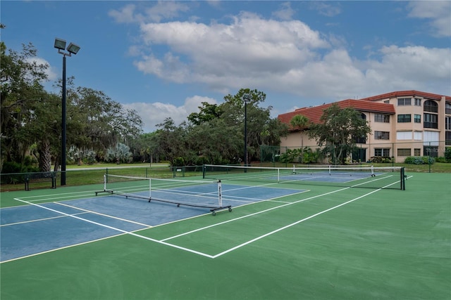 view of sport court with community basketball court and fence