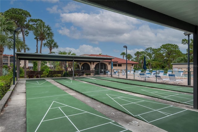 view of home's community with fence