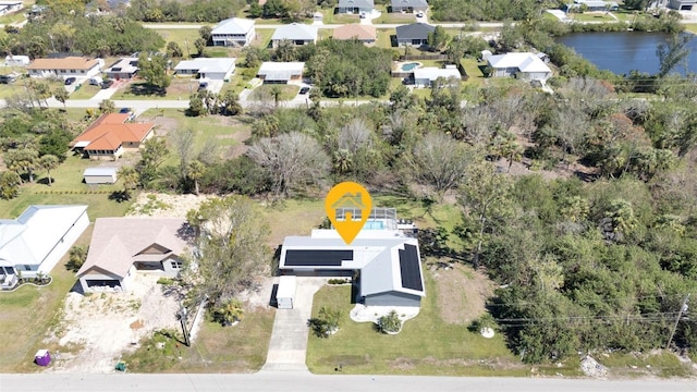 bird's eye view with a water view and a residential view