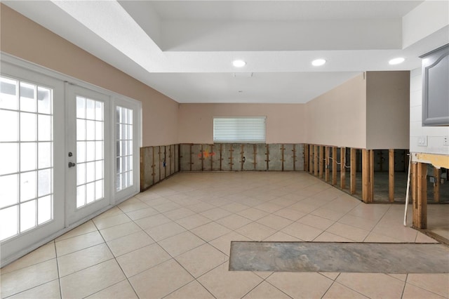 empty room with recessed lighting, french doors, and light tile patterned floors