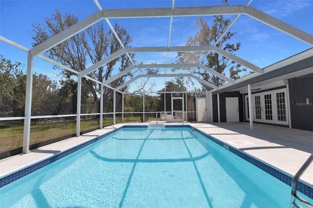 pool featuring french doors, a patio, and a lanai