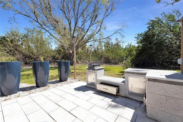 view of patio featuring fence