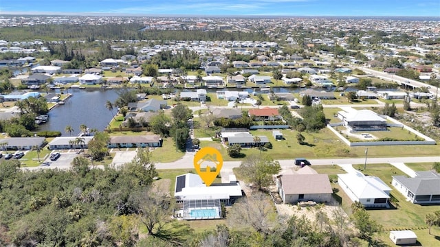 birds eye view of property featuring a water view and a residential view