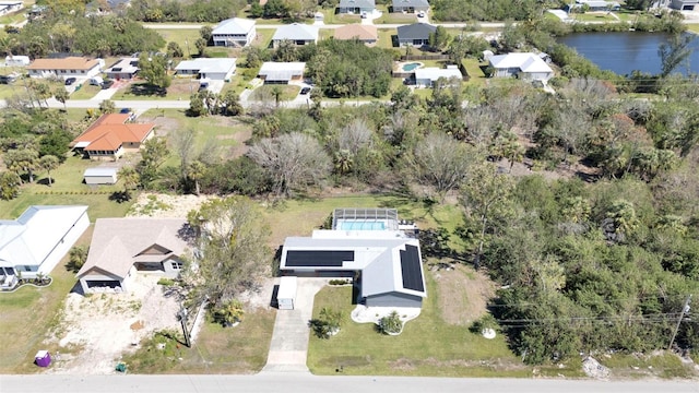 aerial view featuring a water view and a residential view