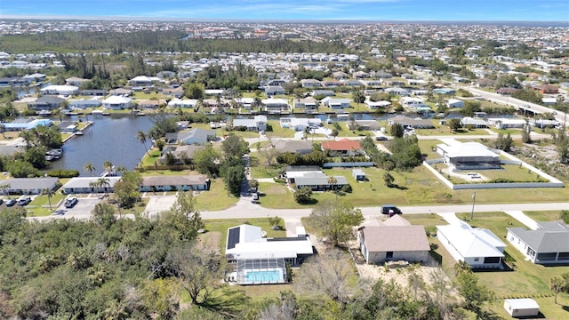 aerial view featuring a water view and a residential view