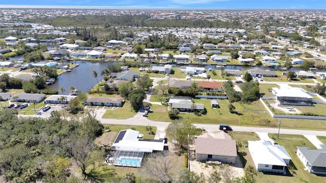 bird's eye view featuring a residential view and a water view