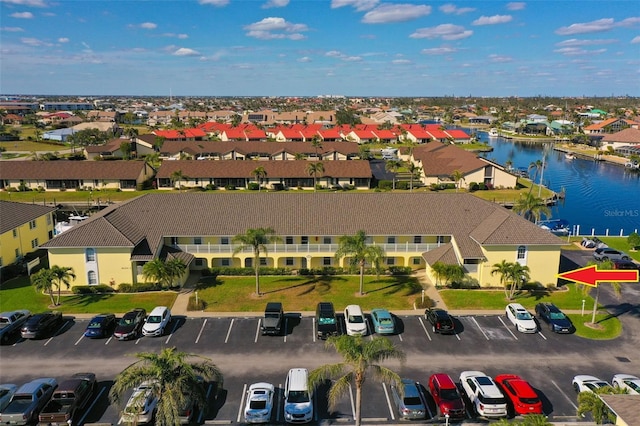 birds eye view of property featuring a residential view and a water view