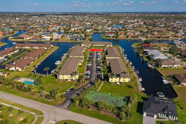 drone / aerial view featuring a water view and a residential view