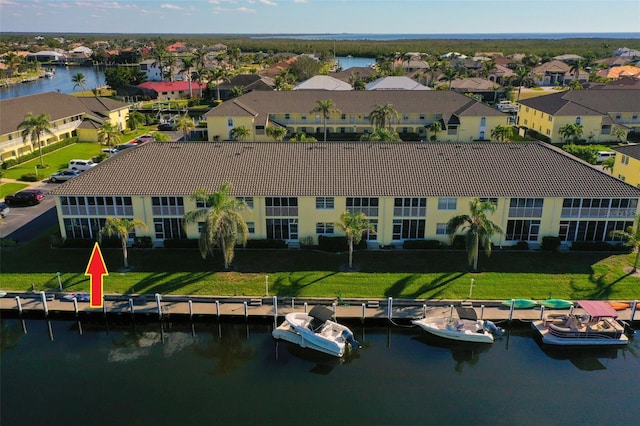 bird's eye view with a water view and a residential view