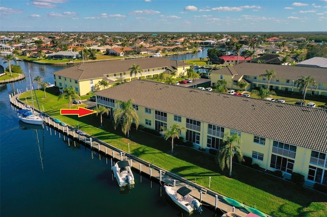 aerial view featuring a water view and a residential view