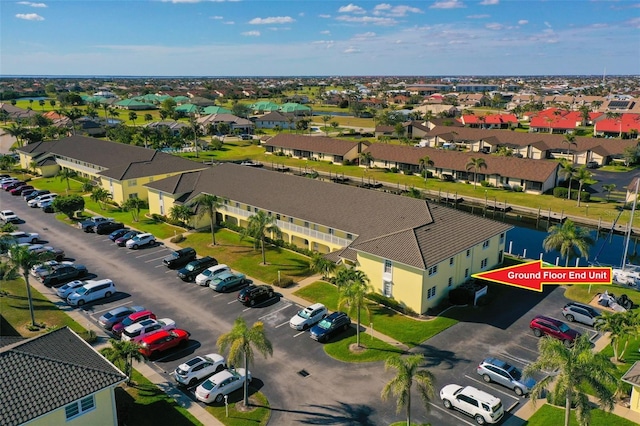 aerial view with a residential view and a water view