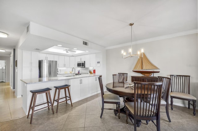 dining room featuring ornamental molding, visible vents, baseboards, and light tile patterned floors