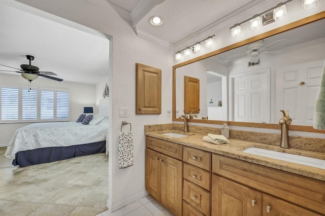 bathroom with ensuite bath, a sink, and a ceiling fan