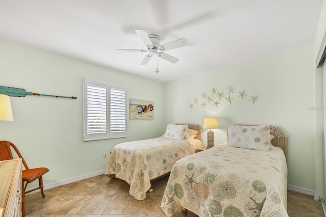 bedroom featuring baseboards and a ceiling fan