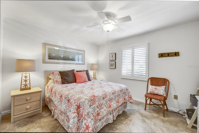 bedroom with a ceiling fan and baseboards