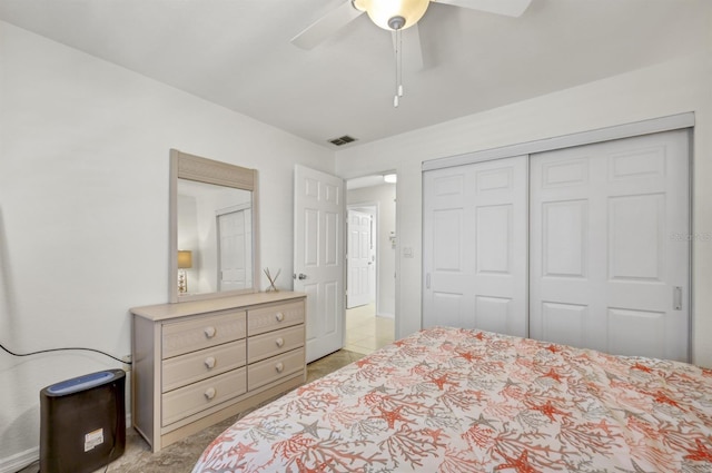 bedroom with a closet, visible vents, and ceiling fan