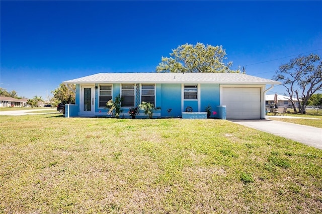 single story home featuring a garage, concrete driveway, and a front lawn