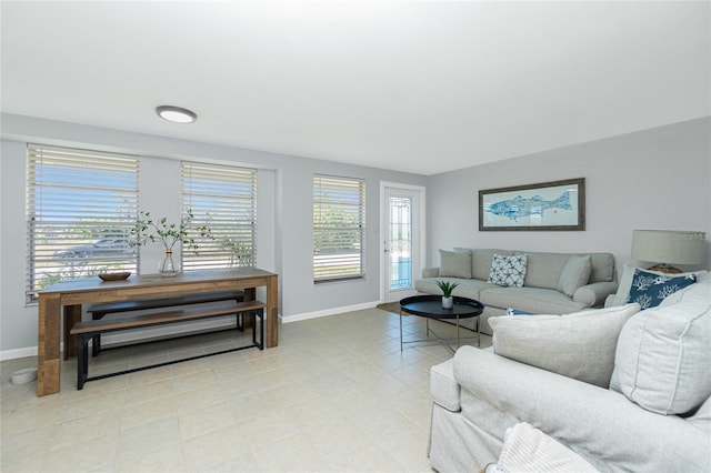 living area featuring baseboards