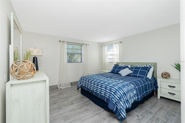 bedroom featuring wood finished floors