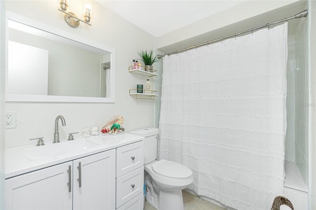 bathroom with vanity, toilet, and tile patterned floors