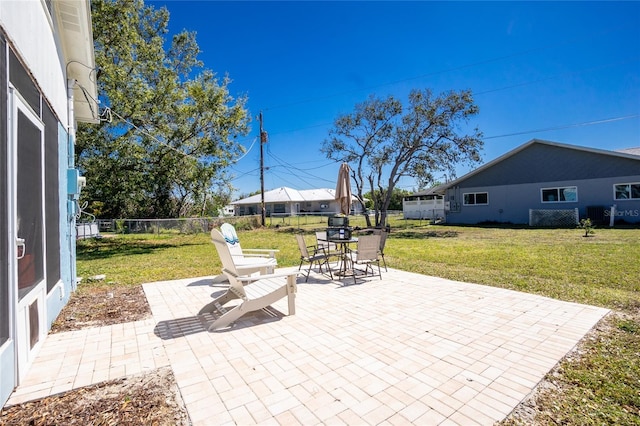 view of patio / terrace featuring fence