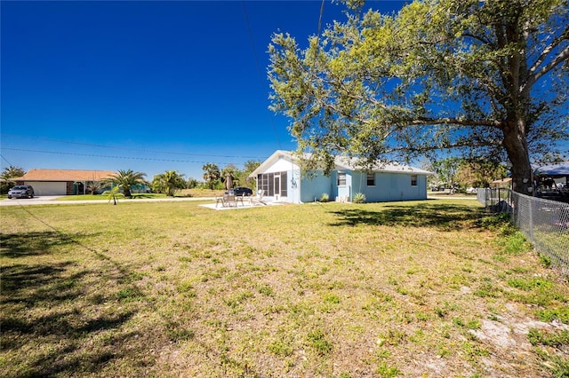 view of yard with a patio and fence