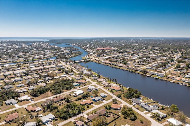 birds eye view of property featuring a water view and a residential view