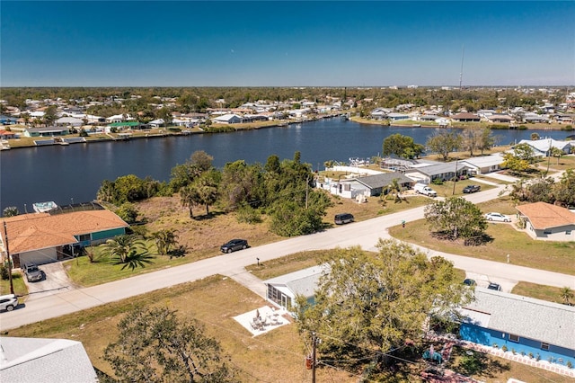 bird's eye view featuring a residential view and a water view