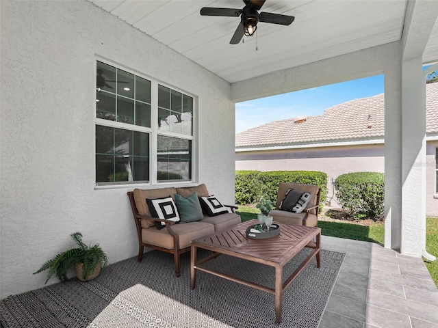 view of patio with outdoor lounge area and a ceiling fan