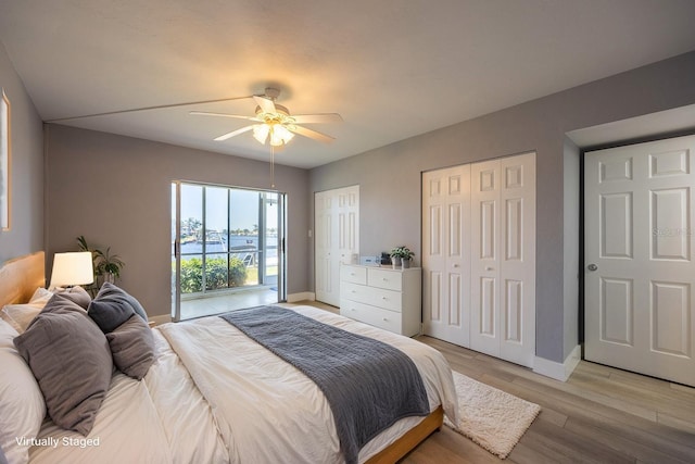 4012 SE 19th Ave Unit 103, Cape Coral, FL 33904 - bedroom with baseboards, light wood-style floors, two closets, and ceiling fan