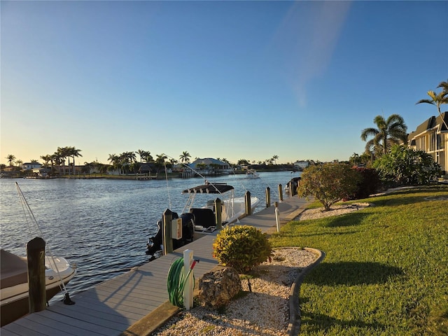4012 SE 19th Ave Unit 103, Cape Coral, FL 33904 - dock with a water view and a yard