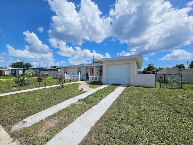 ranch-style house with driveway, a gate, a porch, fence, and a front yard