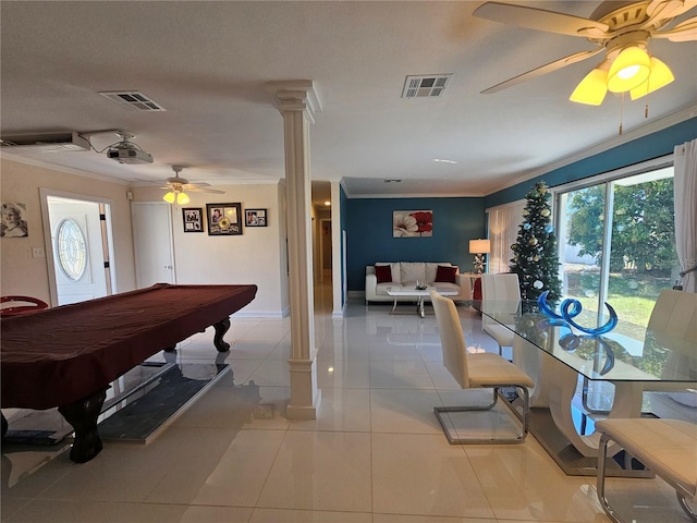 playroom with ornate columns, visible vents, and crown molding