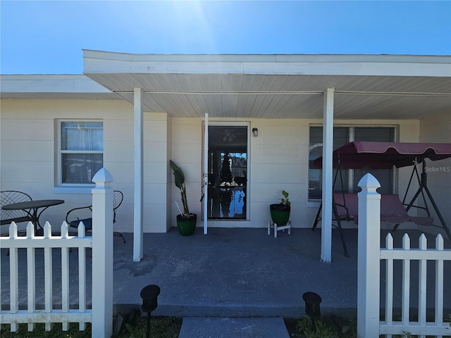 doorway to property featuring a porch