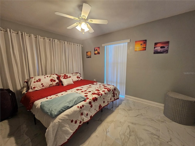 bedroom with marble finish floor, ceiling fan, and baseboards