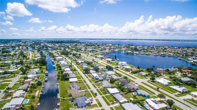 bird's eye view with a residential view and a water view