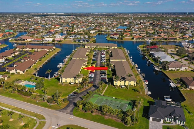 bird's eye view featuring a water view and a residential view