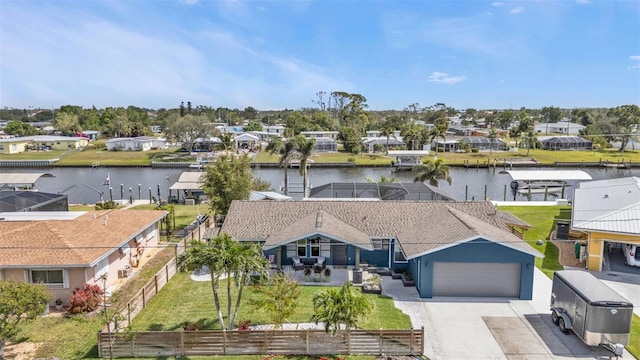 bird's eye view with a water view and a residential view