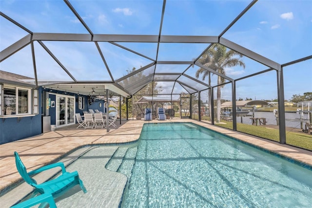 outdoor pool featuring a lanai and a patio