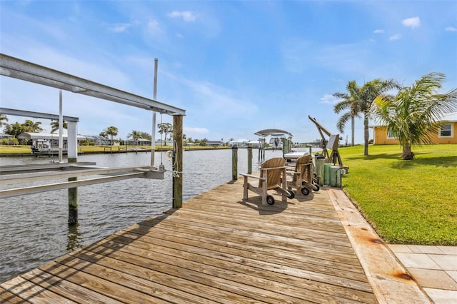 view of dock with a water view, a lawn, and boat lift