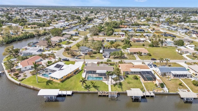 bird's eye view featuring a water view and a residential view