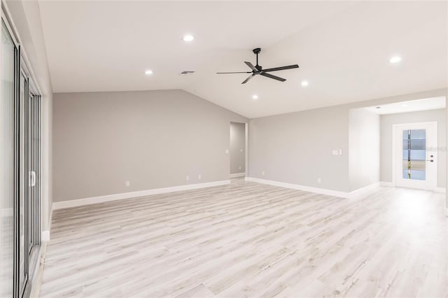 spare room featuring ceiling fan, recessed lighting, baseboards, vaulted ceiling, and light wood finished floors