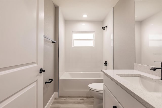 bathroom with shower / bathtub combination, vanity, toilet, and wood finished floors