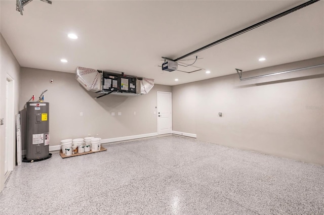 garage featuring recessed lighting, baseboards, a garage door opener, and electric water heater