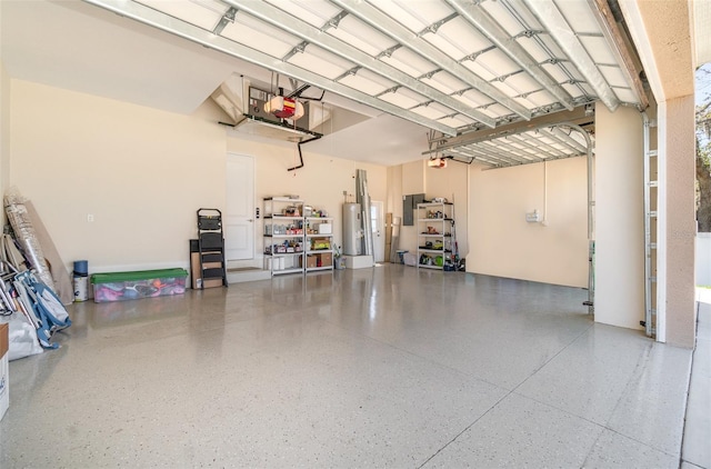 garage with gas water heater and a garage door opener