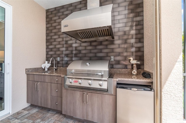 view of patio with a grill and a sink