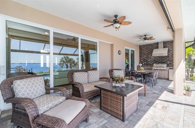 view of patio / terrace featuring area for grilling, a ceiling fan, a grill, outdoor lounge area, and outdoor dining area